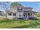 Charming two-story home with a covered front porch and well-manicured lawn at 701 Monticello Ln, Mcdonough, GA 30253