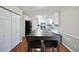 Bright eat-in kitchen with white cabinets, stainless steel appliances, and a large kitchen island at 701 Monticello Ln, Mcdonough, GA 30253