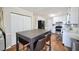 Bright eat-in kitchen with white cabinets, stainless steel appliances, and a large kitchen island at 701 Monticello Ln, Mcdonough, GA 30253