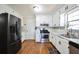 Modern kitchen with stainless steel appliances, white cabinets, modern countertops and backsplash at 701 Monticello Ln, Mcdonough, GA 30253