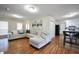 Open-concept living room with hardwood floors and seamless access to the kitchen at 701 Monticello Ln, Mcdonough, GA 30253