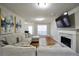 Spacious living room with hardwood floors, a fireplace, and modern decor at 701 Monticello Ln, Mcdonough, GA 30253