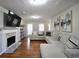 Comfortable living room with a fireplace, hardwood floors, and stylish decor at 701 Monticello Ln, Mcdonough, GA 30253