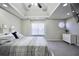 Lovely primary bedroom featuring tray ceilings, ceiling fan, recessed lights, and a window at 701 Monticello Ln, Mcdonough, GA 30253