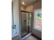 New bathroom featuring a glass shower with tile surround and soaking tub at 877 Highway 101 N, Dallas, GA 30157