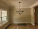 Bright dining room featuring modern chandelier and large windows offering great light at 877 Highway 101 N, Dallas, GA 30157