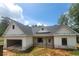 Charming new construction home featuring a two-car garage and bright, white exterior siding at 877 Highway 101 N, Dallas, GA 30157