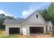 Spacious three-car garage with ample parking and easy access to the home's exterior at 877 Highway 101 N, Dallas, GA 30157