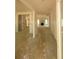 Open-concept hallway leading to a living space with a fireplace and abundant natural light at 877 Highway 101 N, Dallas, GA 30157