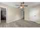 This bedroom has a ceiling fan and access to a bathroom and other rooms at 1237 Park Pass Way, Suwanee, GA 30024