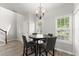 Bright dining area with new flooring, modern lighting, and large windows at 1237 Park Pass Way, Suwanee, GA 30024