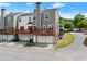 Townhome featuring an attached two-car garage, private balcony, and neutral siding color at 1237 Park Pass Way, Suwanee, GA 30024