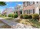 Attractive two-story house with a covered porch, manicured shrubs, and a neatly kept front lawn at 1237 Park Pass Way, Suwanee, GA 30024