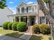 Attractive two-story house with a covered porch, manicured shrubs, and a neatly kept front lawn at 1237 Park Pass Way, Suwanee, GA 30024