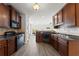 Well-equipped kitchen featuring modern appliances, granite countertops, and ample cabinet space at 1237 Park Pass Way, Suwanee, GA 30024