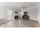 View of the living room with fireplace and access to the outdoor deck at 1237 Park Pass Way, Suwanee, GA 30024