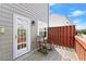 Cozy outdoor patio featuring seating, privacy fence and outdoor access at 1237 Park Pass Way, Suwanee, GA 30024