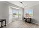 Well-lit room with large bay windows and a small desk at 1237 Park Pass Way, Suwanee, GA 30024