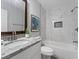 Bright bathroom features granite countertop, modern vanity, and tiled shower at 2811 Mango Nw Cir, Atlanta, GA 30318