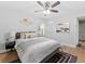 Cozy bedroom features natural light, wood floors and minimalistic wall art at 2811 Mango Nw Cir, Atlanta, GA 30318