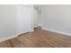 A clean bedroom with hardwood floors and a closet at 2811 Mango Nw Cir, Atlanta, GA 30318