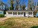 Charming one-story home with a freshly manicured lawn and an inviting entrance at 2811 Mango Nw Cir, Atlanta, GA 30318