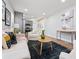A stylish living room featuring hardwood floors, modern furnishings, and seamless flow into the kitchen at 2811 Mango Nw Cir, Atlanta, GA 30318