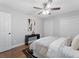 Spacious bedroom with hardwood floors, ceiling fan and neutral decor at 2811 Mango Nw Cir, Atlanta, GA 30318
