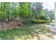 Well-maintained lawn with neat hedges, enhancing the home's curb appeal at 4319 Silver Peak Pkwy, Suwanee, GA 30024