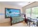 Charming bedroom with a painted mural that brings a tropical paradise indoors at 4319 Silver Peak Pkwy, Suwanee, GA 30024