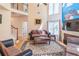 Bright living room with high ceilings, a decorative fireplace, and a unique wall mural at 4319 Silver Peak Pkwy, Suwanee, GA 30024