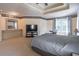 Large primary bedroom featuring a comfortable bed, dresser, and an entertainment center at 4319 Silver Peak Pkwy, Suwanee, GA 30024