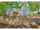Exterior of the house features a well-maintained yard, deck, and brick retaining wall, enhancing the curb appeal at 4360 Havenridge Pl, Cumming, GA 30041