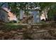 The home's backyard showcases a wooden deck and retaining wall, offering outdoor living and structural support at 4360 Havenridge Pl, Cumming, GA 30041