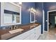 Bathroom includes double sinks, white cabinets, granite counters, with modern fixtures and tiled floors at 4360 Havenridge Pl, Cumming, GA 30041