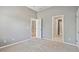 Light filled bedroom with carpet and neutral walls; access to the stairs and other rooms at 4360 Havenridge Pl, Cumming, GA 30041