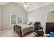 Bedroom with vaulted ceilings, a ceiling fan, and a window showing the well-maintained exterior at 4360 Havenridge Pl, Cumming, GA 30041