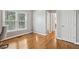 Bedroom featuring hardwood floors, natural lighting, with pet bowls in the corner at 4360 Havenridge Pl, Cumming, GA 30041