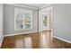 Bright living room with hardwood floors and large window with natural light at 4360 Havenridge Pl, Cumming, GA 30041