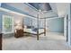 Spacious primary bedroom with custom tray ceiling, large windows, and cozy carpeted floors at 4360 Havenridge Pl, Cumming, GA 30041