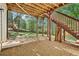 Covered patio with stone foundation offers a shaded outdoor space for relaxing and entertaining in the backyard at 4360 Havenridge Pl, Cumming, GA 30041