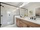 Bathroom featuring marble shower, dual sinks, and vanity at 439 Mezzo Ln # 88, Alpharetta, GA 30009