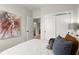Comfortable bedroom features neutral tones, a unique art piece, and a serene atmosphere at 439 Mezzo Ln # 88, Alpharetta, GA 30009