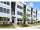 Stylish townhome exterior showcasing modern design with black trim and manicured landscaping at 439 Mezzo Ln # 88, Alpharetta, GA 30009