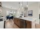 Stylish kitchen with a central island, stainless steel appliances, and breakfast nook with natural light at 439 Mezzo Ln # 88, Alpharetta, GA 30009