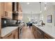 Modern kitchen featuring stainless appliances, black backsplash, and an island with bar seating at 439 Mezzo Ln # 88, Alpharetta, GA 30009