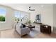 Bright living room with hardwood floors, large windows, and comfortable seating at 439 Mezzo Ln # 88, Alpharetta, GA 30009