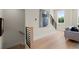 Modern staircase with hardwood floors, wood railing, and natural light from a nearby window at 439 Mezzo Ln # 88, Alpharetta, GA 30009