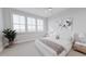 Bright bedroom featuring large windows, neutral decor, and comfortable furnishings at 439 Mezzo Ln # 88, Alpharetta, GA 30009