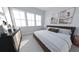 Bright bedroom with a comfortable bed, dresser, and large windows offering natural light at 439 Mezzo Ln # 88, Alpharetta, GA 30009
